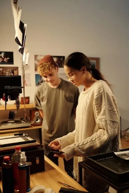 A photograph of the designer collaborating with a team in their studio. The image captures a creative brainstorming session, highlighting the innovative and collaborative environment that drives their brand. It showcases their leadership and commitment to teamwork, emphasizing their dedication to excellence and pushing design boundaries.