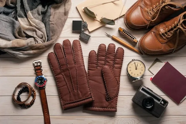 A display of different leather accessories, including belts, gloves, and handbags, in various shades of brown and black. The accessories are neatly arranged on a wooden table.