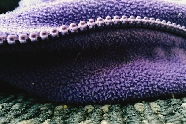 A close-up shot of various fabric textures used in layering, including merino wool, fleece, and waterproof nylon. The image highlights the different properties and functionalities of each fabric.