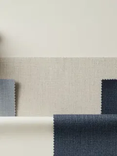 Assortment of natural fabric swatches showcasing cotton, linen, silk, and wool textures.