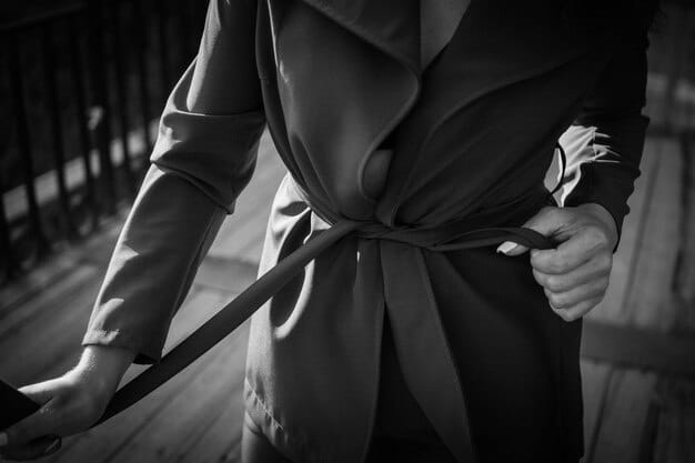 A close-up shot of a statement belt cinching a blazer, highlighting how the belt adds definition and elevates the outfit's silhouette.