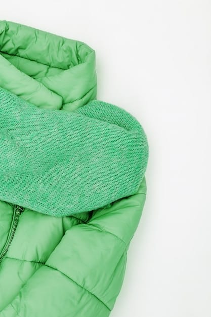 A close-up shot of a puffer coat made from recycled materials, showcasing its quilted texture and eco-friendly label.