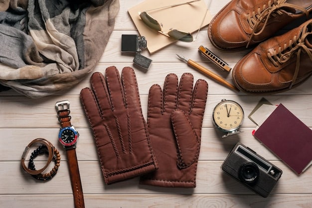A display of different leather accessories, including belts, gloves, and handbags, in various shades of brown and black. The accessories are neatly arranged on a wooden table.