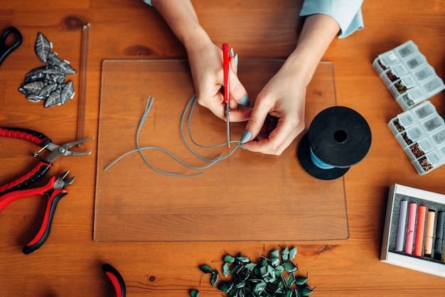 Close-up of a designer attaching a small, flexible circuit board onto a piece of intricately woven fabric, using miniature tools in a brightly lit studio filled with fashion design equipment.