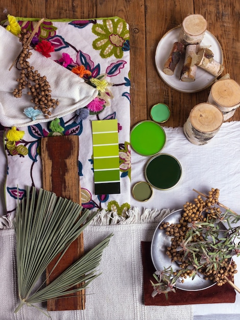 Assortment of different plant-based fabrics, showcasing their textures and colors. The fabrics include hemp, bamboo, and pineapple leaf fibers, arranged on a wooden table in a well-lit studio.