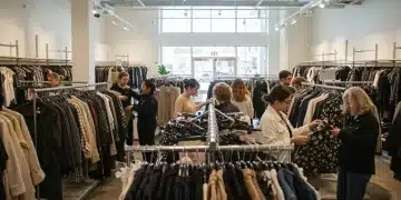 Affordable & Sustainable Fashion: Your Style Guide People happily shopping for affordable sustainable fashion in a vibrant thrift store.