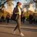 Woman in tailored athleisure blazer and technical leggings for day-to-night transition