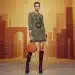 Model wearing bold Fall 2026 accessories including geometric necklace and structured mini-bag