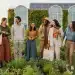 Diverse individuals happily modeling sustainable fashion in an urban garden setting, reflecting conscious consumer choices.