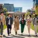 College students displaying diverse fashion trends on a bustling university campus in the US.