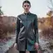 Model in innovative Fall 2026 outerwear showcasing new fabric technology.