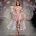 Model in flowing pastel dress, embodying Spring 2026 Neo-Romanticism trend